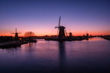 Romantic Dutch Sunset with Windmills